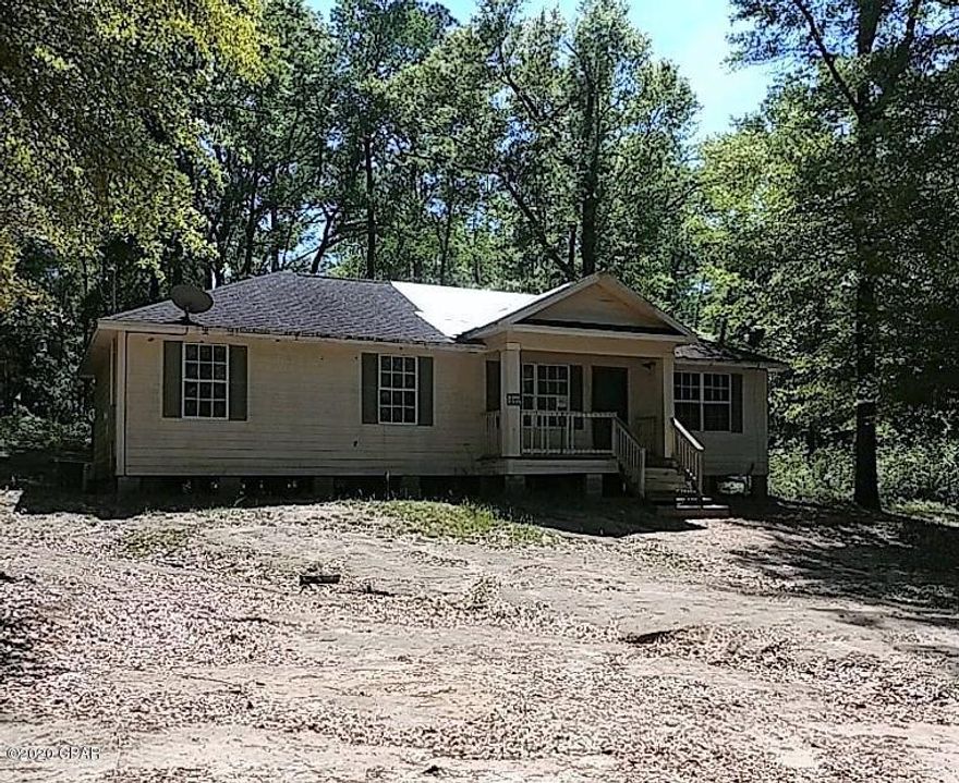 4-Bedroom, 2-Bath house on 2.25 acres located 7 miles from Bonifay, Florida in a quiet area of Dogwood Lakes.  This community has a club house, two lakes, a golf course and no association fees.  Large Living Room and Master Bedroom.  Separate dining area with bay window overlooking the back yard.  Nice fenced area in back yard and land has some really beautiful trees.  No Owner Financing or Rental options.  Buyer to verify all matters of importance to them prior to contract.