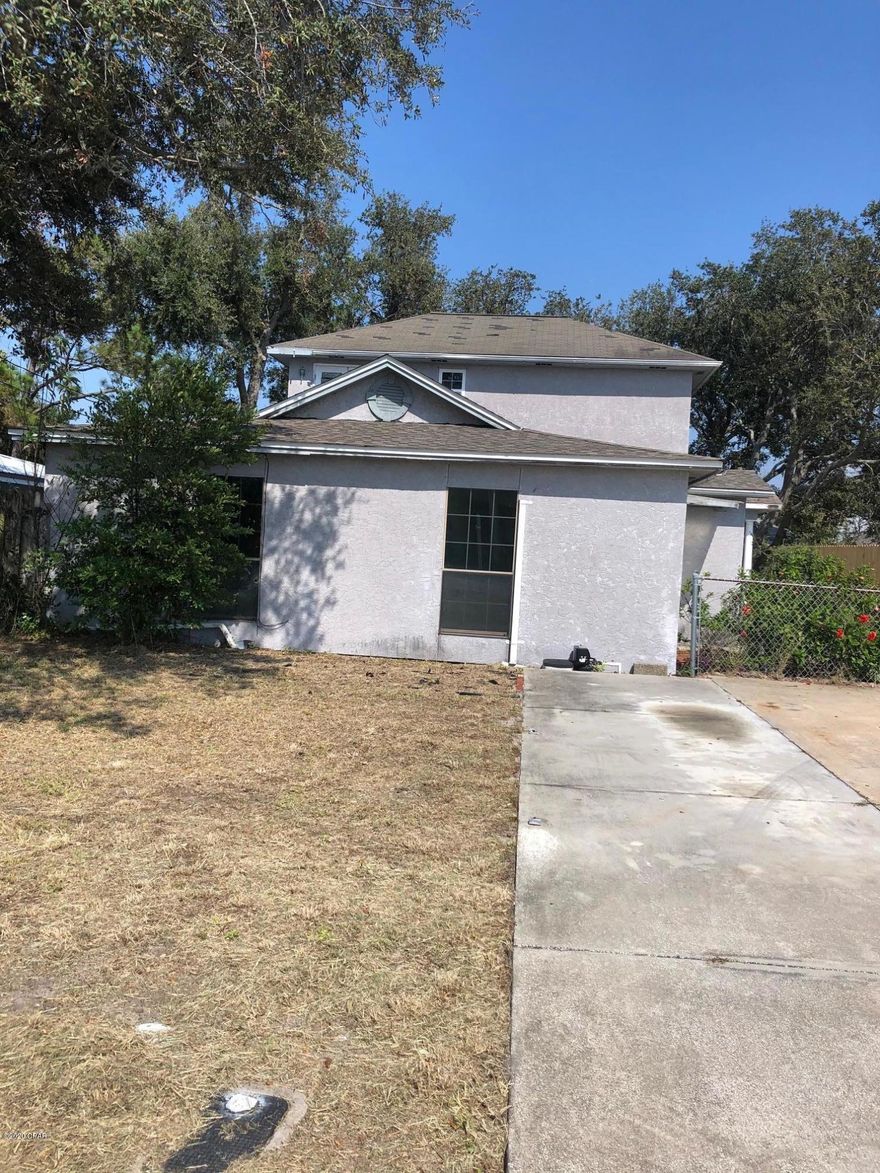 Looking for the perfect BEACH INVESTMENT OPPORTUNITY? This large BEACH HOME is located between Gulf access and  2 Grand Lagoon boat ramps. This would make an ideal vacation rental and is set up to maximize rental income with 3 full baths! Lots of potential to update floor plan and finishes to buyers taste. New survey provided to buyer. Possible owner financing available with substantial down payment . This is an an incredible opportunity to enjoy your own private BEACH HOUSE  and generate income.