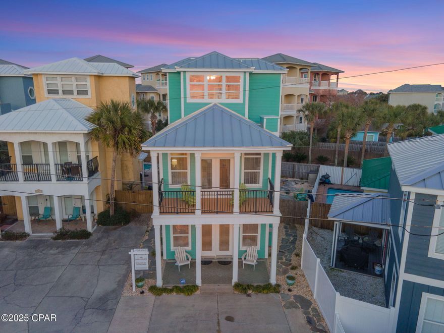 Located on the West end of Panama City Beach, this charming beach cottage is located just steps from the 94 beach access and offers beautiful Gulf views from the second and third floors. Stepping through the front door you're immediately welcomed into an open concept living, dining, and kitchen. With oversized windows surrounding the entire space, natural light spills in creating a warm environment for gathering. The kitchen features new stainless steel appliances and granite countertops. Off the kitchen, the first of three bedrooms is located on the first floor and features a walk-in closet and a full bath located just outside. Moving upstairs to the second level, the master suite is located on the South side of the home and features large windows and private balcony to soak in the Gulf views. The master bedroom offers its own ensuite as well as ample storage from multiple closets. The third bedroom is located on the North side of the home and offers a queen sized bed and has its own ensuite. The third floor bonus area is outfitted with two twin beds and a wet bar with sink and beverage cooler. The highlight of course are the beautiful Gulf views that span the horizon. In the backyard oasis, gorgeous flagstone interlaced with white rocks creates an easy to maintain area that is highlighted with a fire pit, custom swing set, and outdoor dining area. This space is large enough to accommodate a pool if desired. Located within a quick walk to the beach or a short drive to both 30A or Pier Park in Panama City Beach, this home is set up to be your ideal beach cottage.