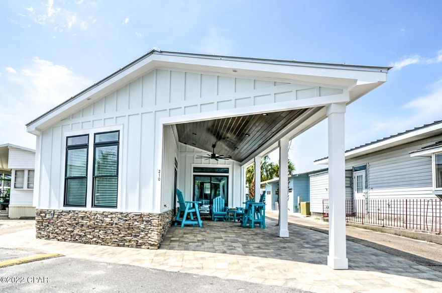 CURRENTLY UNDER CONTRACT, SELLER WILL CONSIDER BACKUP OFFERS - Rare opportunity to own a brand-new home in highly desired Venture Out resort! Check out this beautiful 3 bedroom, 2 bath home. Shiplap, LVP flooring, tankless hot water heater and standing seam roof are only a few of the great features of this beach beauty! Great open floor plan with large rooms throughout. Located adjacent to a golf cart path which gives you that extra room between you and the neighbor. This beauty has a large, covered porch with plenty of room for grilling and relaxing after a long day at the beach. Perfect fit for an investment home or second home. It doesn't get better than this! Venture Out is a golf cart community that has exploded with popularity recently... With 300' on the beautiful pristine beaches of the Gulf of Mexico and 1,000' on the Grand Lagoon. Venture Out has something for everyone. With 2 pools, fishing pier, boat ramp, mini golf, & more