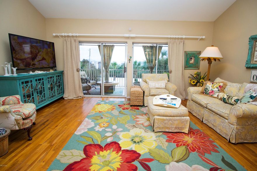 ~*~*~EXTREMELY UNIQUE OPPORTUNITY!!~*~*~ This home is the only home to come available in Spyglass Townhomes in a VERY long time, & has a Gulf view!! Owners love this complex, and you don't want to miss out on the opportunity to buy here. Walk roughly 200 feet to the Boardwalk and you are AT THE BEACH! This property would make the perfect vacation rental or primary home for someone! There is a community pool just off your porch that is RARELY used! It is almost like having your own pool right in your back yard!! This home features a first floor master, and a second master upstairs, beautiful wood flooring, stylish sliding barn doors, and the home shows pride in ownership throughout. The outdoor space and balcony is the right setting for watching the sun set. There is even a murphy drop down bed that can convey with the right offer. Be sure to check out the beautiful sliding shutters, they are very unique and give a beautiful feel to the bottom floor master bedroom. All of the appliances are newer, and you won't believe how nice this unit is!! Schedule your showing now and don't miss out on this opportunity! --There are too many ammenities to list, and this home is a must see in person! 

All sizes and measurements are approximate. Buyer to verify if important!