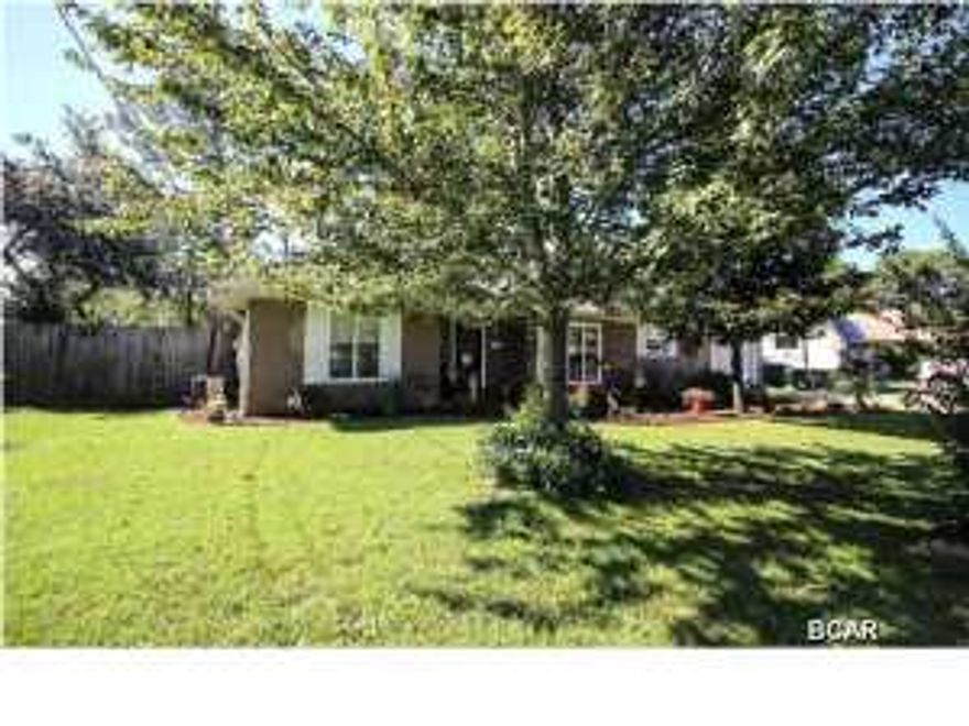 Very nice well kept home located in a quiet neighborhood and on a dead end street, no thru traffic to worry with. Well landscaped yard, extra parking pad for RV or boat. Privacy fenced yard with sprinkler system with lawn pump and yard building as well as nice screened porch. Split bedroom floor plan, master has it's own private bath, living room has a nice corner brick front gas fireplace, cathedral ceilings and dining area just off the kitchen, nice open floor plan. There is ceramic tile throughout the home. Very cozy home located close to the beach.