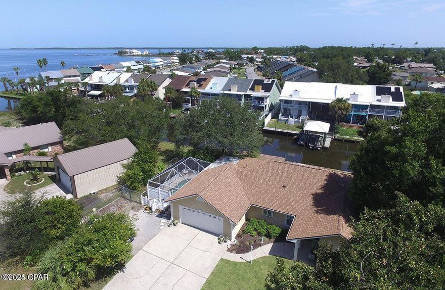 MAJOR PRICE REDUCTION!!! MOTIVATED SELLER!!! WATER FRONT HOME w/100 ft seawall and 40 ft PRIVATE DOCK !!! Welcome to 1220 Tuscany Road!! Experience the perfect blend of Southern charm and Coastal Flair in this home. Step out your back door on to your skiff or jet ski and within minutes you can be in the Gulf of America!! The HVAC was replaced in 2015, the roof was replaced in 2019, and water heater in 2024, new hurricane rated garage door installed in 2024. This home has GENUINE HARDWWOOD FLOORS throughout and are in IMMACULATE condition! The City is in the process of updating the sewer and water system and repaving the streets throughout the neighborhood is ALMOST completed now. This is definitely a MUST SEE home to experience that Southern Coastal feel and also see that THIS waterfront home could very well be YOUR waterfront home! Make the call today and see it all for yourself.