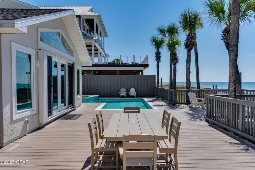 Welcome to your private slice of gulf front paradise - or ''Parrotdise'' as this home's namesake for the original stained glass archway featuring a parrot in the main floor! Oleander Dr. is uniquely positioned in PCB as the only middle beach side street offering more privacy than any other road on our beach. This exclusive home is centrally located to both the east or west end with the adorable neighborhood park, Maggie Still, just a quick walk across the street. 

This beautifully furnished, turn-key retreat offers 60 feet of direct beach frontage and 2025 vacation rental bookings already on the calendar! Whether you're seeking an elegant coastal residence or a high-performing investment, this property delivers on every front.

This exquisitely updated 4-bedroom, 4-bathroom estate includes a versatile bonus room complete with its own kitchenette on the second floor, ideal for multi-generational guests or group travel.

Step outside to your resort-style backyard, where you'll find a custom automated heated pool and spa surrounded by composite-reinforced decking that seamlessly blends with panoramic Gulf views. It's the ultimate space for entertaining, relaxing, or soaking in the sunset.

Additional highlights include:

Spacious two-car garage with ample additional driveway parking

Upgraded 400 amp electric service plus dedicated 50 amp RV hookup

Automatic privacy gate and fully fenced yard for security and seclusion

Luxury vinyl plank flooring on the main level

Beautiful custom tile showers

Outdoor shower for beach days made easy

Whether you envision this as your full-time residence, a vacation oasis, or a luxury rental, 13211 Oleander Dr offers the best of Gulf Coast living with modern comforts, privacy, and undeniable charm.