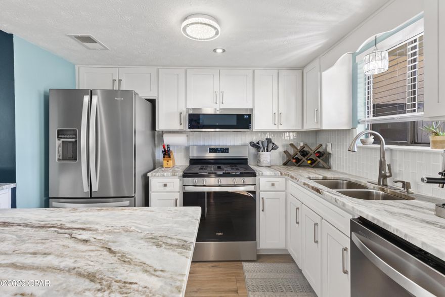 **Turnkey short-term rental opportunity** in the highly sought-after Gulf Highlands Beach Resort! This updated 2 bedroom, 2.5 bath townhome is ideally positioned just a 5-minute walk to the beach and backs up to a seasonally heated pool, a location renters love and seek out.

The interior has been thoughtfully refreshed with new granite countertops, stainless steel appliances, modern light fixtures, and low-maintenance LVP flooring, making it both stylish and durable for rental use. The flexible floor plan includes a bonus room, perfect for accommodating additional guests or creating a dedicated home office—adding value and rental versatility.

Gulf Highlands Beach Resort is a gated community offering unmatched amenities, including 11 swimming pools (5 seasonally heated), shuffleboard, an 18-hole putt-putt course, pickleball, tennis courts, and private beach access. Short-term rentals are allowed, making this an excellent income-producing property in a proven vacation rental market.

Whether you're expanding your investment portfolio, looking for a vacation rental, or planning a future second home, this property offers strong rental appeal, resort-style amenities, and an unbeatable Panama City Beach location.