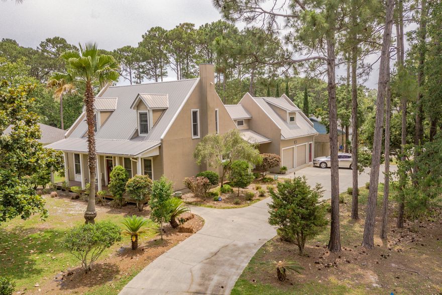 Gorgeous 3 bedroom 2 full bathrooms plus (2) 1/2 baths and a large BONUS room situated on a corner lot with horseshoe driveway in Grand Lagoon Shores! This home features many upgrades to include new laminate flooring, new custom cabinetry, crown molding, new patio, pergola, and outdoor kitchen since 2012. Living room has a gas fireplace and is open to remodeled kitchen with subway tiled backsplash, coffee bar, and stainless steel appliances. Master suite is downstairs and has stenciled flooring. 2 spacious bedrooms and full bath upstairs as well as BONUS room over garage with 1/2 bath. 2 car garage, breezeway, ample parking, fruit trees, beautiful landscaping, and much more! All sizes/info/measurements approx, please verify if important.