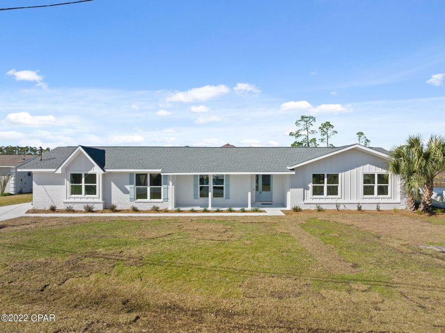 **WATERFRONT, completely renovated, Ranch style home in the heart of Lynn Haven**

This Coastal inspired home boasts 3 bedrooms/2 full baths plus an office. Open concept dining, living AND bonus living for all your entertaining needs. Large kitchen attached to a separate breakfast nook with brand-new stainless-steel appliances. Wainscoting throughout entire living space. Formal dining also features built in bar/dining nook with a STUNNING fireplace in the heart of the home. Home features quartz countertops throughout. Master bedroom has 1 walk-in closet and one standard size closet AND an on- suite sitting room with a personal Master deck off of the Master suite. Deep water with dock and the ability to add a boat slip for all your boating needs. Call today for your private showing.