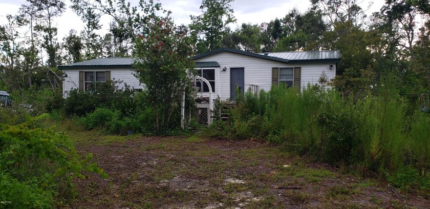 Southport, Over 3/4 of an acre!! Only 4 minutes to Tharp's landing at Deerpoint lake, 7 minutes to McCall-Everett Boat Ramp at North Bay, and 8 minutes to Deer Point Lake swimming & park. Perfect as an investment or starter home. 3 bedrooms 2 baths with a fireplace and a metal roof. Needs a good cleanup & fresh paint.