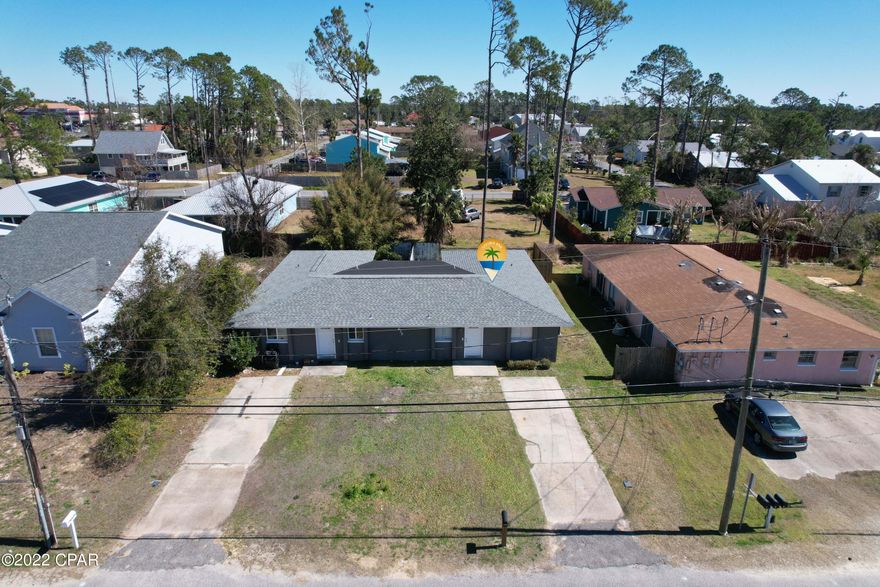 Multiple offers! Highest and best by 5 PM Central time 2-22-22!  Close to some of the best restaurants and grocery stores at the Beach!! This is near  the state park and the beach as well as being even closer to the Grand Lagoon.  There is a walk-in clinic a few minutes away if you need medical attention. This duplex has a total of 6 Bedrooms and 4 bathrooms. One side is now vacant to view- (Please do not disturb the tenant on the other side.) The yard is fenced and each unit has 3 bedrooms, 2 baths, a family room, an extra bonus area, a laundry area, and a storage closet.