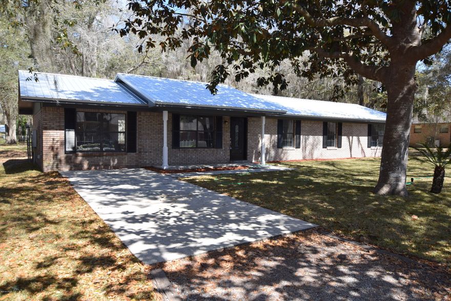 Below Appraisal! Completely renovated 4br/2ba home just around the corner from a public boat ramp on Deer Point Lake! New matching granite in the kitchen and baths. New custom soft close shaker cabinets in the kitchen & baths.  New flooring throughout. Fresh paint throughout. All new fixtures.  New high end stainless steel appliances. New HVAC. New metal roof. Fresh sod laid out front.Large bedrooms.  The Master Bedroom has a massive Walk-in Closet with a Barn Door. All this is situated on a 0.46 acre lot. Plenty of room for a pool, work shop, and still have yard for the kids! The seller is offering 2% of purchase price in Closing Cost assistance with a full price offer. You will absolutely love this home! Make your appointment to see it today. Measurements approximate, verify if important