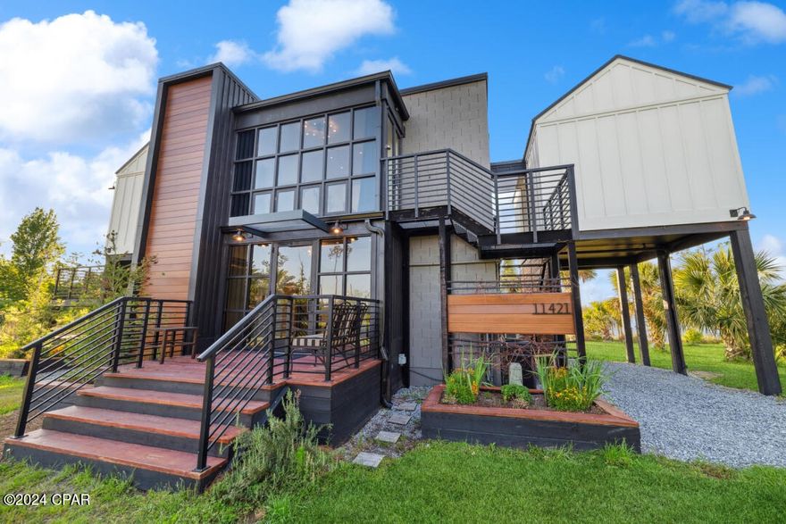 Step into a realm of unparalleled luxury and innovation with this stunning single-family home, meticulously crafted in 2020. Beyond its modern façade lies a world of refined elegance, where every detail exudes sophistication. Immerse yourself in contemporary opulence within, complete with a stainless steel elevator for effortless access and upscale finishes throughout. Venture outside to discover a resort-style oasis, featuring a mesmerizing pool that beckons relaxation and recreation. Perched atop 20-ft arsenic stilts, this home offers breathtaking views that stretch as far as the eye can see, enveloping you in awe-inspiring beauty. And for the adventurous spirit, a charming treehouse retreat awaits, nestled amidst the verdant surroundings.