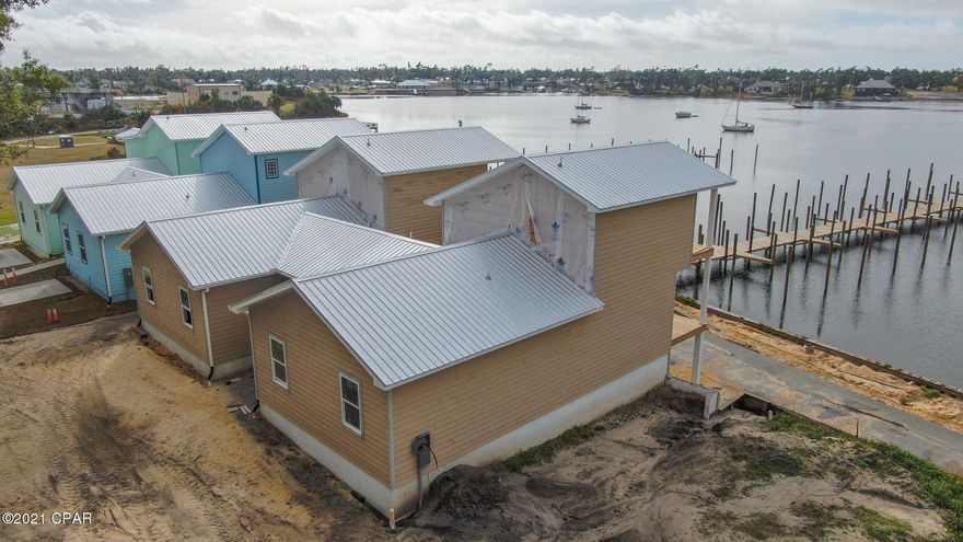 This development opportunity consists of multiple means of acquisition. Currently 23 lots would be inclusive to this sale. Each lot would have the availability to lease a deep water slip with each sale at the amount of $1,000.00 per slip per year. The boat slip has the capability of housing  a boat up to 50' in length. This is an excellent investment opportunity to complete development of a waterfront community with excellent access to the Bayou and the Bay and the Gulf.  The seller will consider financing the development with a minimum of 30% down. The Marina can also be purchased outright as well as the parcel where the marina office now exists. That parcel can be divided to build 3 more waterfront homes. The property does have the zoning to do some multi units as well.