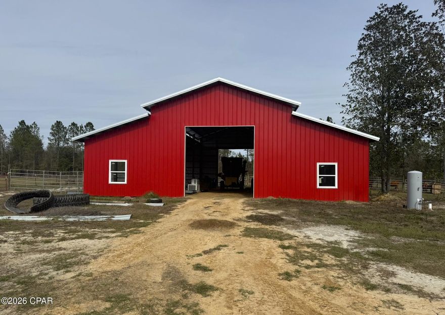 Pole barn houses seem to be a hot commodity. Well, here is your chance to convert this beautiful barn into a home, or leave it as a barn and build your new home or place a mobile home on this beautiful 17.75 acres. No restrictions!! The property is on a paved road, fenced, with water and power. Most of the property is high and dry, with a very small wet section on the south side. There is also an option to buy the 62 acres adjoining it for a separate price. Located in peaceful Grand Ridge, Jackson County Florida, Home of Southern hospitality! C'mon!

This parcel ID is a total of 41 acres. On this particular parcel 1 acre will be cut out and not sold. ONLY  17.75 acres will be sold at this price. The remainder 22 +- acres will be sold with the the back 40 acres separately. Parcel ID 14-4N-08-0000-0020-0000 for a total of 62 +- acres.  Please call for any questions!