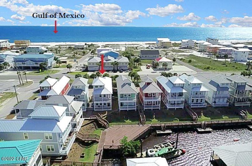 IMPRESSIVE 4BD/2.5BA HOME W/GULF & CANAL VIEWS LOCATED IN THE COTTAGES AT WATERSIDE VILLAGE IN MEXICO BEACH. Modern & contemporary fixtures elevate a nicely appointed open space w/custom cabinetry, granite tops, range hood & mosaic tiles. Sophisticated glazed glass doors infuse natural light complimented by a full length glass entryway to the lower level deck. Located upstairs is an attractive guest BA, laundry & the primary suite w/balcony access, canal views, double vanity & tiled shower. One of two guest BD opens to a gulf facing deck for sunsets & a salt air breeze. Winding up to the 3rd level is a tranquil space for relaxing & amazing water views. Community amenities include a heated pool, lighted boardwalk & boat cleats for day docking. Steps away are white sand beaches.
