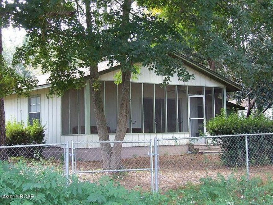 OWNER FINANCING AVAILABLE! 3 bedroom, 2 bath cozy but roomy cottage located on the 8th fairway of the golf course. Nice screened porch on the golf course side. Separate one car garage that can be used as a workshop. covered double carport. Lots of Azaleas and Dogwoods. Call today to see how easy it is to own this one!