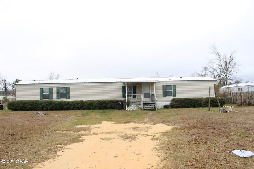 Single wide home on very large yard with storage shed in the back yard. Covered front porch deck and open deck on the back of the home.