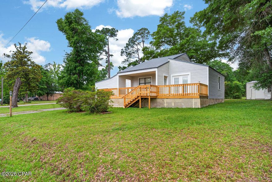 Welcome to peaceful lake-area living with beautiful views of Compass Lake! Located on a quiet private road with few neighbors, this charming home offers amazing water views from the covered front porch and open decks on each side. French doors from both bedrooms open directly to the decks, creating the perfect place to relax and enjoy the scenery.

Inside, the home features high ceilings, a bonus room, and two bedrooms, each with its own private bath and walk-in closet. Recent updates completed in March 2026 include a new front deck, remodeled bathrooms with new showers, toilets, vanities, mirrors, and fixtures, new flooring in the kitchen, laundry room, spare room, and bathrooms, new interior doors, new baseboards, recaulking of trim, and fresh interior paint. Additional improvements within recent years include the roof, siding, A/C, water heater, and submersible pump.

Outdoor features include a covered back porch with a swing, paved driveway, room for backyard parking, an attached garage with storage room, and a detached 2-car garage with a concrete foundation and 220 power accessible. Private lake access is located right across the street, perfect for paddleboarding or kayaking, with three public boat ramps nearby. A peaceful setting, incredible views, and plenty of storage make this Compass Lake property a must-see!
