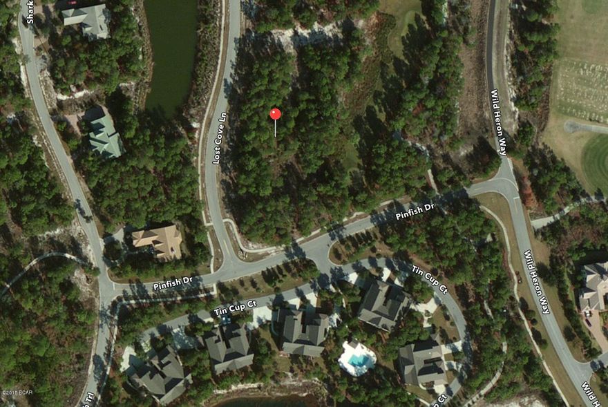 ***Bring all Offers*** LARGE LOT - enough for Pool and Outdoor Kitchen MOTIVATED SELLER! BOUNDARY AND TREE SURVEY INCLUDED IN PRICE! Premium Golf Course Lot located on #10 of the famed Sharks Tooth Golf Course. Wild Heron is an upscale, gated community nestled alongside beautiful Lake Powell. Featuring a unique Coastal Craftsman architecture and offering exclusive amenities. Become one of the fortunate few to enjoy this privileged coastal lifestyle! BEST PRICE AVAILABLE ON THE GOLF COURSE!! Priced to sell quickly.