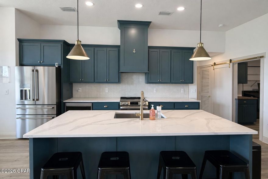 Built in 2025 on a spacious 0.29 acre lot, this 5 bedroom home blends modern comfort with the relaxed feel of the Game Farm community. Enjoy natural preservation areas, pond, walking paths, and future park in a setting that feels tucked away yet close to everything. Inside, you will find plenty of owner added refinements, elevated ceilings and an open layout that creates bright, connected living spaces. The privacy fenced backyard and covered patio offer a perfect place to unwind or entertain year round. With a 3 car garage and a location close to everyday essentials, this home blends space, efficiency, and lifestyle with move in ready ease.