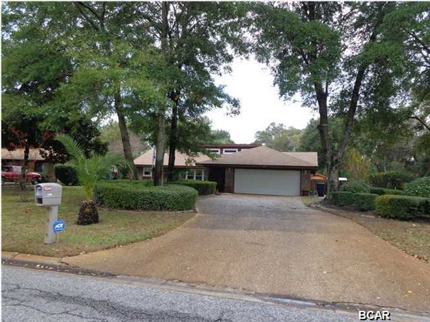 PRICE REDUCTION!! OWNER SAYS SELL!! Beautiful ranch style home located on a large tree-shaded lot in the desirable Candlewick community. The open living, dining and kitchen area contains recessed lighting and a striking wood burning brick fireplace. The three bedroom split-level design is very accommodating with ceiling fans in all rooms. Master bedroom has a large walk-in closet. There are also beautiful black kitchen appliances with a glass cook top. Tile floors are present throughout the entire home. $21,000 windows were replaced in 2008 with storm windows and hurricane shutters installed. The rear half of the roof was re-shingled in 2011 and the front half in 2002. The A/C system was replaced in March 2010 and a screened-in porch was added at the same time. The pool pump was