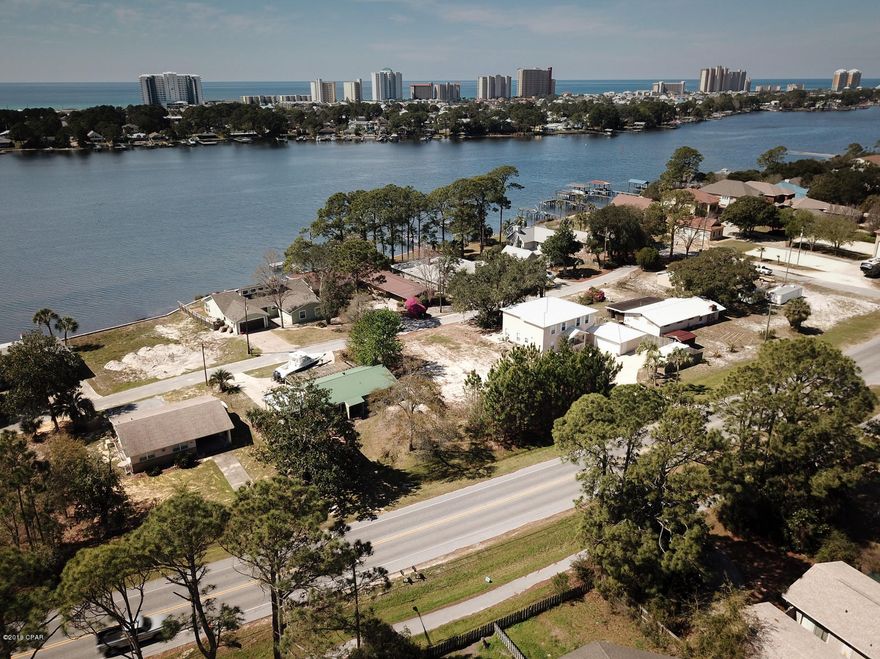 Building lot right across the street from and giving views of Grand Lagoon.  Close to the east side of Thomas Drive which gives you quick access to shopping, dining, and entertainment.