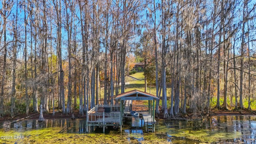 CURRENTLY UNDER CONTRACT, SELLER WILL CONSIDER BACKUP OFFERS

Welcome to 5091 Lake Bluff Circle in Indian Springs, a waterfront home offering peaceful views and everyday comfort on approximately 1.6 acres.

This 4-bedroom, 2-bath home overlooks Merritt's Mill Pond, a 202-acre, spring-fed lake approximately 4 miles in length. Water views are enjoyed from both the family room and living room, where sliding glass doors open to a screened-in back porch (approximately 344 sqft), creating a comfortable indoor-outdoor living space.

The kitchen features stainless steel appliances, a convenient eat-in bar, and views of Merritt's Mill Pond from the kitchen, keeping the water in sight during daily routines.

Merritt's Mill Pond allows for canoeing and swimming, offering opportunities to enjoy the clear, spring-fed waters directly from the property. A private dock provides convenient access to the pond.

The primary bedroom offers direct access to the screened porch, a California-style closet, and a private bathroom with dual vanities and a walk-in tiled shower. One of the additional bedrooms is currently used as an office, providing flexible living space.

Additional features include a fenced backyard, two-car garage, mud room, paved driveway, and a location approximately one mile from Indian Springs Golf & Country Club.

If you're looking for a waterfront property with space, water views, and access to a spring-fed lake, this home is worth seeing. Schedule your private showing today.