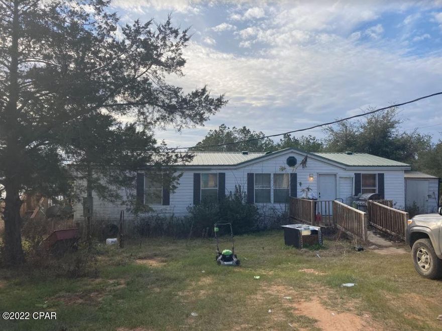 Waterfront!! Investment opportunity!! 3/2 double wide mobile home in need of updating with a roof that is 3yrs young and the HVAC is 5yrs young. Quiet, peaceful setting east of Compass Lake. Well and septic in place.