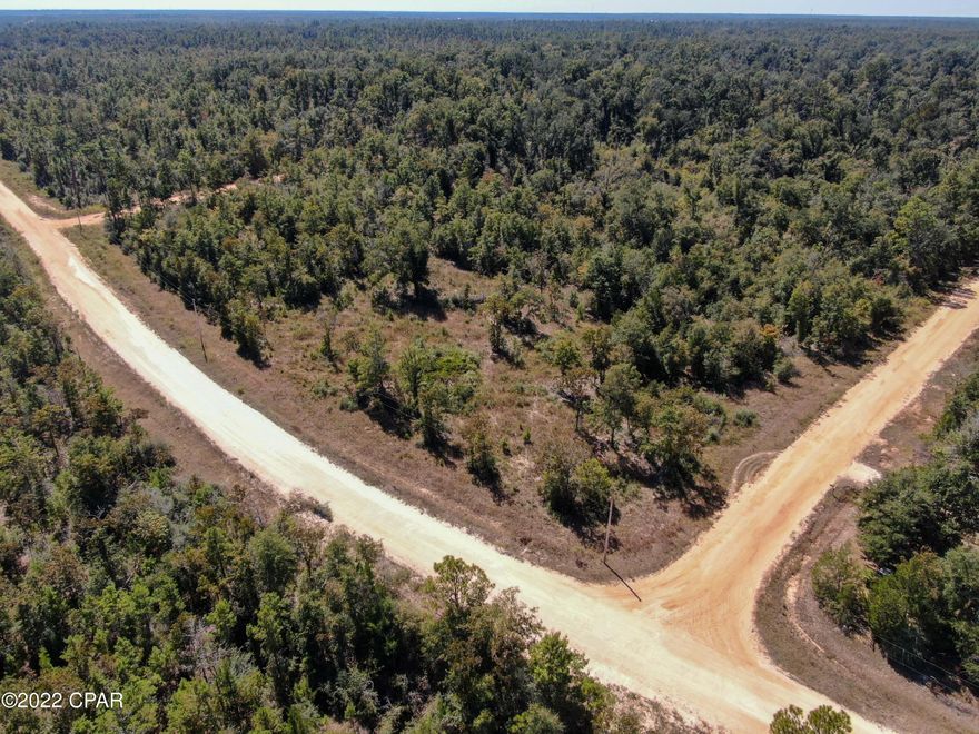 Excellent corner lot in Compass Lake in the Hills subdivision. Convenient to the two large lakes both Compass and McCormick Lake. No gasoline engines on McCormick Lake. HOA fees are voluntary but are required to utilize the amenities.