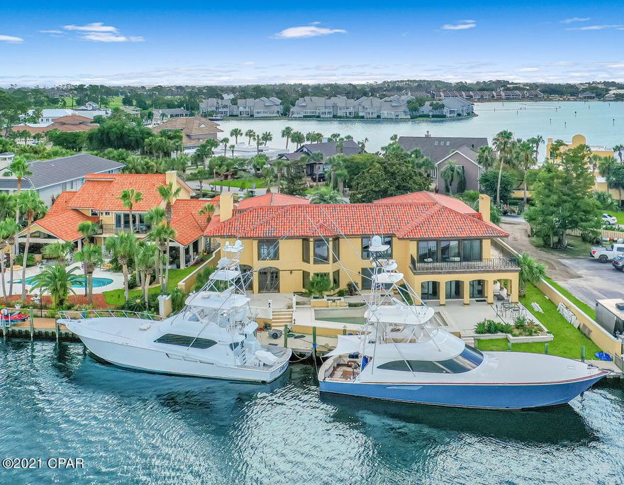 Mediterranean style home with a little TLC needed! Main level features formal living room, open dining room with a kitchen that's almost completely renovated. Guest quarters on main level with 3 bedrooms, w/ private baths. Oversized master bedroom upstairs with sitting room, walk-in closet and balcony overlooking the Bay. Two additional  bedrooms upstairs for a total of 6 bedrooms. Large bonus room with built in bookcases. Library/trophy room with spiral staircase and elevator to family room! Plenty of storage with custom finishes.  Large patio space with in-ground pool. 100ft of deep water access. Home being sold AS IS and no furniture. Measurements are estimates from property appraiser website. Please measure for accuracy if important.