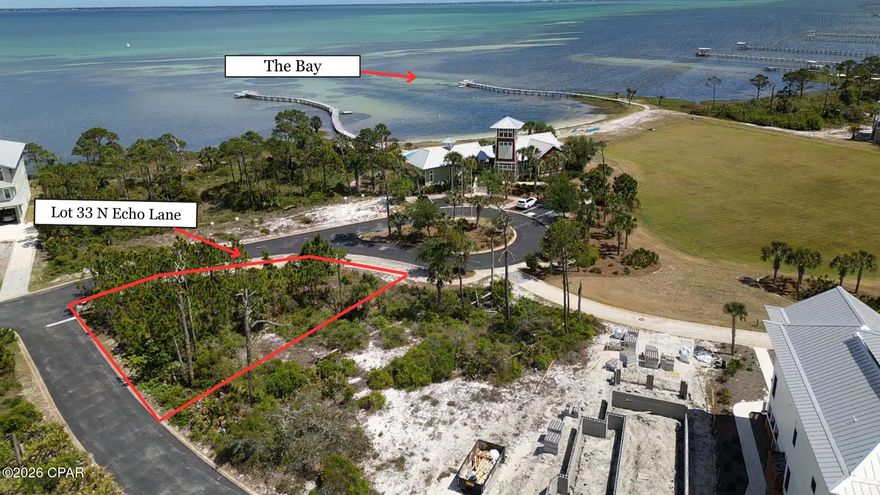 OVATION LIVING AWAITS!! Spectacular PEEKABOO Bayview corner lot in the coveted Ovation community.  Lot 33 N Echo Ln offers the perfect setting to build your dream coastal retreat in one of Cape San Blas' most desirable communities. Ideally positioned on a corner homesite, this property captures serene bay glimpses while providing added space, flexibility & privacy for your custom design. Located on the North end of the Cape, Ovation is a thoughtfully planned development known for its natural beauty, upscale amenities & laid-back coastal lifestyle. Residents enjoy deeded access to both the Gulf & the bay, giving you endless opportunities for beach days, sunset watching, kayaking & fishing adventures. The community amenities are truly unmatched, featuring a bay front pool, beachside pool, fitness center & an elegant community room perfect for gatherings. Beautifully maintained landscaping & expansive conservation areas create a peaceful environment where native wildlife thrives, offering a true connection to nature right outside your door. Paved walking & biking trails wind throughout the Cape, ideal for morning strolls, dog walking or family bike rides. Just a short drive away, St. Joseph Peninsula State Park--voted one of the best beaches in America--offers miles of untouched shoreline, boating, hiking & outdoor recreation. You're also a quick drive to Port St. Joe where you can enjoy local dining, boutique shopping, marina access & year-round community events that make this coastal town so special. With short term rentals allowed, this property also presents an excellent opportunity for investment or a future income-producing vacation home. This is your chance to secure a prime homesite in a premier community where lifestyle, location & natural beauty come together seamlessly. Present your offer today & start planning your coastal escape. Call for your private tour & LIVE THE BEACH LIFE!