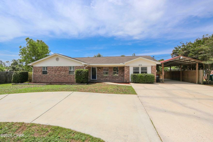 No HOA, a spacious 4 bedroom, 3 full bath, 2,042 square foot layout, 0.28 acres, and an assumable 2.5% interest rate option all in one of Bay County's most convenient locations. Situated in unincorporated Panama City just north of Highway 390 near the expanding SweetBay area, this property offers flexibility, usable space, and easy access to Panama City shopping, dining, restaurants, retail, schools, hospitals, Publix, University Academy, Lynn Haven, PCB, and everyday conveniences.

With continued commercial and residential expansion planned throughout the nearby SweetBay area over the coming years, many buyers are keeping a close eye on the area's long term growth and development. The property is also conveniently positioned near restaurants, walking trails, the growing commercial corridor, and the future marina development planned nearby.

Inside, the spacious layout offers a great mix of original character and recent updates throughout select portions of the home. You will find fresh interior paint in several rooms, durable vinyl plank flooring, and a charming kitchen featuring unique brick look floors and newer appliances including the oven and dishwasher. In addition to the main living areas, the home also features a separate den complete with a fireplace, creating an ideal secondary living space, game room, or cozy gathering area.

The converted garage serves as a private 4th bedroom suite or flexible bonus room separated from the main living area. Complete with its own full bathroom, this space works perfectly for long term guests, a quiet home office, private guest suite, hobby room, or multi generational living arrangement. The home also features a separate laundry room with direct backyard access for added convenience.

The exterior is designed for functionality, accessibility, and storage. Sitting on approximately 0.28 acres, the property features reinforced gates positioned throughout multiple areas of the property allowing easy front to backyard access. The circular driveway provides plenty of parking options, while the detached covered carport located beside the home measures approximately 38 feet long by 14 feet wide and includes lighting, making it ideal for boats, small RVs, trailers, covered parking, workshop space, storage, or additional vehicles.

The property also features a covered back patio, an additional storage building with attached covered storage area, and a private light located near the end of the driveway connected to the property's electric service averaging approximately $20 per month for added visibility and convenience.

Qualified buyers may also have the opportunity to assume the remaining loan balance of approximately $178,000 at a 2.5% interest rate, with the buyer responsible for bringing the remaining balance to closing or obtaining secondary financing for the difference if needed.

Whether you are looking for a primary residence, second home, or investment opportunity, this property offers a rare combination of usable space, flexibility, convenience, and location in a highly desirable Bay County area.

All information is deemed reliable but not guaranteed. Buyer to independently verify all measurements, features, zoning, intended uses, and any information deemed important