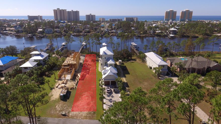 Dreaming of building a new home on the water? This lot will help you realize your dreams and make you the envy of many, with its sunrise and sunset views over Grand Lagoon, quick access to St Andrews Bay, Shell Island and the Gulf of Mexico as well as convenient location to restaurants and shopping. Quaint, private neighborhood with new houses on both sides. Get ready to enjoy  your slice of waterfront living.