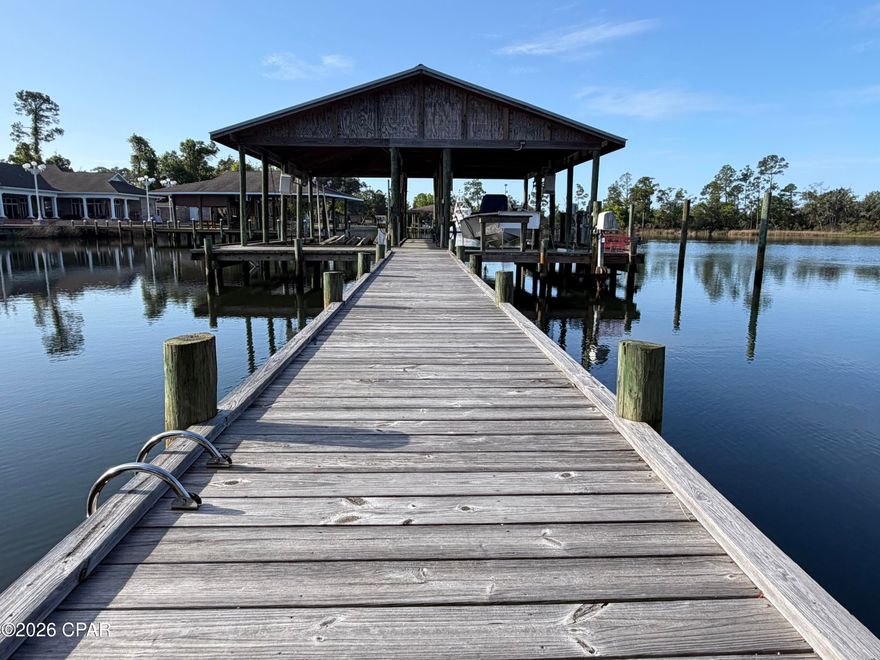 This waterfront home with your personal boat lift is a real treasure. Located on peaceful Lynn Haven Bayou, you'll want to jump at this rare opportunity! It's not often you can get into a waterfront home with views like this, but now is your chance! Enjoy sitting back on the screened in porch watching the wildlife, a beautiful sunset, or relaxing after a long day of fishing! This home comes with a recently rebuilt boat house (aerial pics are old) and boat lift. Water and power is available at the dock for all your maintenance needs. Additionally the location is perfect to enjoy everything the city of Lynn Haven has to offer. 

The home is a 3 bedroom 2 bath with approx 2000sq ft of living space. Huge master bedroom with french doors in it's entry. 2 bedrooms are on the water side with siding doors leading to the patio. Living room is also on the water side. 2 of the sliding doors are multiple panels and are extra wide so those rooms can be really be opened up to enjoy those perfect Florida days.