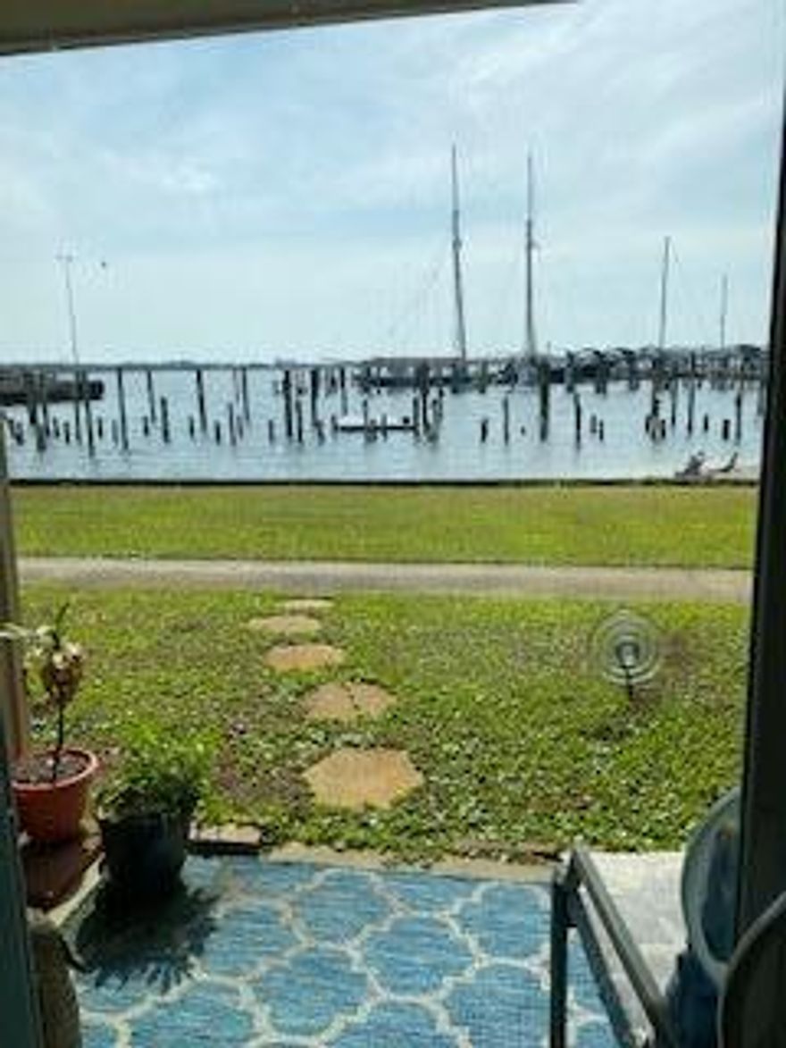 First floor condo makes it easy to bring in groceries and luggage.   Fully furnished (most furniture is new) with a great waterfront view.

There is a fenced pool area and the condo laundry room is close by.  This condo is just across the bridge from the World's Most Beautiful beaches.  HOA includes water, sewer, garbage, cable and exterior insurance.