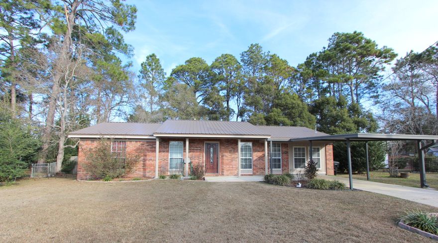 This is the hidden gem you've been looking for! Updated home in a quiet neighborhood close to TAFB and town. This 3 bdrm/2 ba home has had approx $20K in updates/upgrades including a NEW metal roof -installed Nov 2017, double paned windows, freshly painted exterior, new vinyl plank flooring in the living room/entry, new carpet in the bedrooms, newer tiled shower in the master, fresh paint in two bdrms, updated kitchen & appliances and the list goes on. Theres's also a large laundry room/pantry off the kitchen with lots of storage. Outside there's more storage with 2 storage sheds and a 12x20 workshop with electricity and a screened porch. This home has been lovingly maintained and is priced to sell. Please call your agent to schedule a showing today - you won't be disappointed. Thank you.