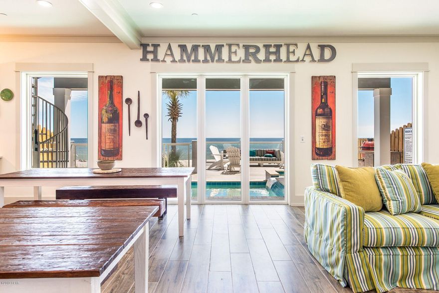 This brand new custom-built four-story beach house is move-in/rental ready and already has summer bookings. This home has a projected income of over $300,000 a year thanks to its prime gulf-front location and 5,198 square feet of luxury vacation lifestyle. Ideal for beach weddings, family reunions, corporate retreats and friends' get-togethers, this beautiful home pampers up to 30 guests with 9 bedrooms including a bunk room, 9.5 bathrooms and plenty of parking. Two fully equipped catering-size kitchens take care of breakfast pancakes to holiday meals or midnight feast. The refectory-style table is a natural gathering place for dining and discussing the day's activities. For dinner, head out along Front Beach Road in either direction and you'll find many options from crab shacks, beach cafÃ©s, ice cream parlors and restaurants all within a mile. When you're not swimming and sunbathing on the white sandy beach, there's a game room and two living areas for relaxing, swapping stories or watching a movie. There's also a loft overlooking the oversize private pool with hot tub. Dive in â€“ the water is perfect. Those in search of quiet moments to relax with a magazine will enjoy plenty of private space on 1200 square feet of decking on four different levels. Soft sea breezes and fantastic emerald gulf views make outdoor living a pleasure on the pool deck and glass-paneled balconies. Panama City Beach offers fishing charters, shopping malls, ZooWorld, go-karts and Wonderworks attractions, making this the ideal base for vacations at any time of year.