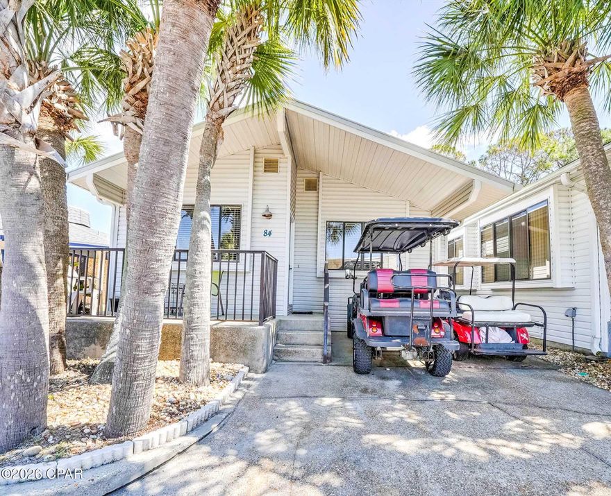 Welcome to your own private coastal retreat in the highly sought-after gated golf-cart community of Venture Out in Panama City Beach! This beautifully maintained 3 bedroom, 2 bath home is one of the larger homes within the community and offers the perfect blend of privacy, nature, and beach lifestyle with the rare bonus of having St. Andrews State Park directly behind the property -- creating a peaceful, natural setting that is hard to find within the resort.

This spacious and inviting home features an open-concept floor plan with warm coastal touches throughout. The large living area offers vaulted ceilings, abundant natural light, and plenty of room for relaxing or entertaining. The kitchen includes ample cabinetry, generous counter space, and a functional layout that opens seamlessly into the living spaces.

The oversized primary suite provides a comfortable retreat with plenty of space, while the additional bedrooms and baths offer flexibility for guests or rental potential. Offered furnished, this home is move-in or rental ready.

Step outside to enjoy one of the property's standout features -- the expansive outdoor patio area overlooking the natural beauty of St. Andrews State Park. Enjoy privacy, tropical landscaping, and the peaceful surroundings while still being just a short golf cart ride to the beach, pools, marina, and resort amenities.

Located in Venture Out, one of Panama City Beach's premier gated waterfront communities featuring:

Private beach access to the Gulf of Mexico
2 swimming pools
Private boat ramp
Fishing pier on Grand Lagoon
Tennis, pickleball & basketball courts
Playground & picnic areas
24/7 gated security
Golf-cart friendly community

Whether you are looking for a primary residence, second home, or vacation rental investment, this unique property offers an incredible opportunity to own a larger home with unmatched backyard privacy inside Venture Out!