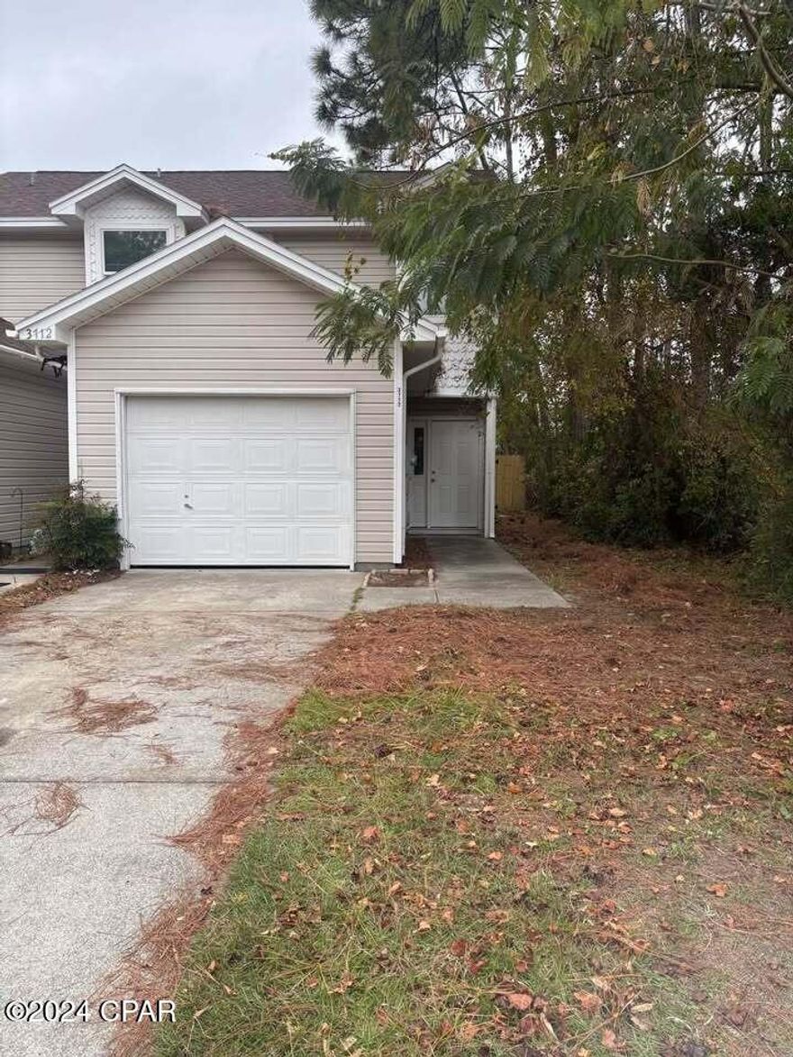 Panama City Beach - Built in 2004, this spacious 2 bedroom, 2.5 bath townhome has just been renovated.  Brand new vinyl plank flooring upstairs, tile downstairs and in all baths,    Master suite has 2 walk-in closets, trayed ceiling and a balcony.  Part of a duplex so you only have one neighbor.  Attached one car garage.  Indoor laundry room with washer and dryer.  Kitchen has stainless appliances including built in microwave, dishwasher, stove and refrigerator with icemaker.  New privacy fenced backyard.