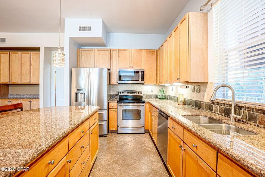 Location! Location! Location! A rare ground floor corner unit is now available at an affordable price. Walking distance and steps away from your covered car parking, no elevators to deal with, very close proximity to the front gate, pool area, clubhouse and amenities.  Welcome to the Exclusive Island Reserve Condominium Community.  This stunning ground floor corner unit is a spacious three bedroom, two and 1/2 bath boasting 1761 square feet of beautifully designed living space and  open floor plan concept. The unit features high ceilings, bamboo and tile throughout, crown molding and additional storage space. The kitchen is equipped with stainless steel appliances, granite counter-tops, and ample cabinetry and pantry. Large split  master bedroom with trey ceilings and as you walk into the master bathroom, you are greeted by a garden tub, separate shower, granite counters with double sink.  You have and abundance of large windows surrounding the living room, thus bringing in natural lighting through. Built in wall cabinets and separate dinning area overlooking the living room,  with entertainment and relaxation in mind.  The wrap around porch is ideal for your morning sip of coffee and tranquility.  The amenities are above and beyond and offering more than your normal local beach condos. 
A large waterfall pool with hot tub,  indoor basketball court, ping pong area, theater room with a 100 inch screen, club house, pickle ball court, and updated exercise room, volley ball and aerobics area and conference room.  Walking distance to the peaceful grounds and serene amazing courtyard out of this world.  This is a 5 star resort living and only less than 2 miles from our white sandy beaches, restaurants and shopping.  You cannot find a 1700 plus square foot condo with all of these amenities.  If you have children, they will love this community and will beg to visit the pool and indoor basketball court daily.  Pier Park is 15 minutes away and San Destin only 25 minutes. HOA includes numerous services and all you pay is your Electricity and personal Wifi upgrades. The Association covers all external repairs, grounds-keeping and pest control.  Take advantage of this  immaculate bottom floor corner unit as it will   not last long.