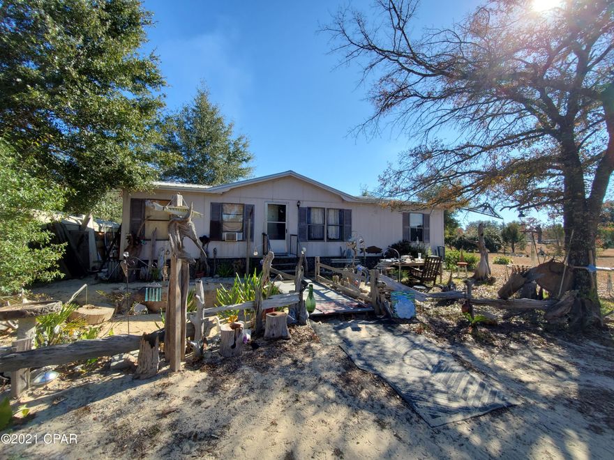 CURRENTLY UNDER CONTRACT, SELLER ACCEPTING BACKUP OFFERS Country living, come and get it! Near Compass Lake, this 1-acre property is the wide open spaces you've been searching for. Cozy home is ready for you to move in. Property has two wells. Home is not far from Hwy 231 which takes you south to PC, PCB, and north to I-10, Marianna. Call for your showing today!