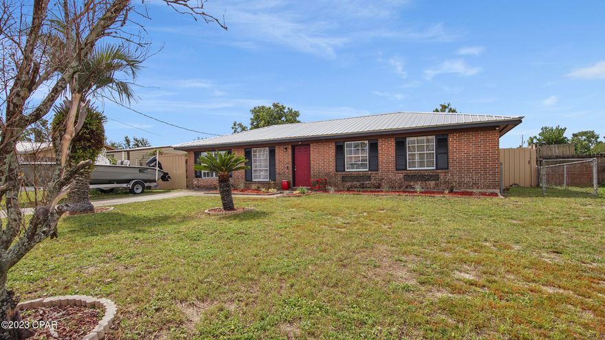 Absolutely adorable! You will not be disappointed in this lovely home! 

This brick home has great curb appeal and features a metal roof, 4 bedrooms, 1 full and 1 1/2 bath, large dining room, living room and family room, large kitchen with pantry. Good storage throughout! Large inside laundry room.  Vinyl plank flooring throughout! Barn doors leading to the enormous family room.  

Large driveway, nicely landscaped front yard and huge fenced back yard with a 12x24 shed, firepit, deck with planter boxes! (all sizes approximate and taken from public records, buyer to verify any details buyer deems important).