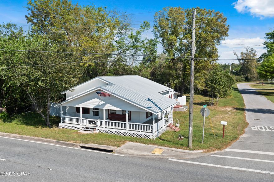 CURRENTLY UNDER CONTRACT, SELLER WILL CONSIDER BACKUP OFFERS. Brand new metal roof with 25-year transferable warranty! Charming, historical home located on a large lot in Cottondale. Fall in love with the original hardwoods on the floors and ceilings. They have been resealed to brighten up their character. Raised ceilings, large rooms, wide trim, huge wrap-around front porch, and walk-through closets are all some of the characteristics that take you back to the early 1900s. A lot of the home was kept original, but don't worry, all of the electrical and plumbing (pvc) was replaced with new this year along with other renovations. Indoor laundry screened back porch, and kitchen w/stainless appliances. The large corner lot offers a yard building, some fencing, and trees for privacy.