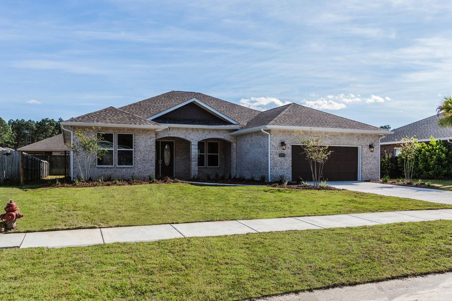 New Construction in the Community of The Landings in Lynn Haven, Fl. This home features 4 bedrooms with 3 full bathrooms, split floor plan with a nice large open living area. Home includes hardwood flooring, Porcelain Tile in the bathrooms, 3 stage Crown Molding throughout whole house, Granite counter tops in the Kitchen and bathrooms. In the Master Bathroom you will find a large walk in shower, Garden Tub, double vanity and a Closet the size of another room! This house has all the upgrades you are looking for in a new home. Also, large covered patio in the backyard and will be completed with an professional landscape plan. Call for details.