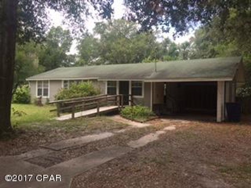 PRICE REDUCED!  MOTIVATED SELLER...HANDYMAN SPECIAL, FIXER UPPER... A LOT OF HOUSE FOR THE MONEY!!! Centrally located on a beautiful lot with mature trees.  Two out buildings, one with electricity. 3 Bedrooms/1 Bath, plenty of closets.  Beautiful knotty pine in family room.  All tiled except for formal dining room.  Indoor laundry room.  Back yard is chain-link fenced.  Floor joists replaced approximately 8 years ago, windows replaced and plumbing replaced with pvc piping.