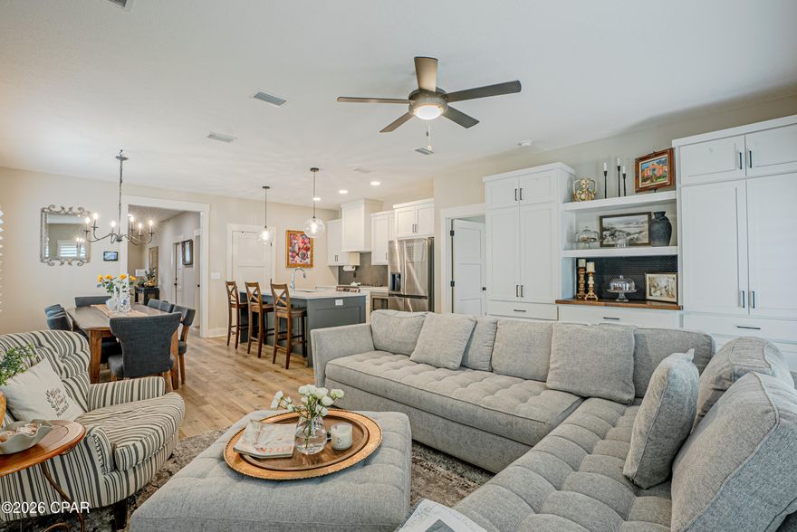 Experience the perfect blend of durability and sophisticated design in this incredibly well-maintained 2023 brick home. Boasting 5 bedrooms, 2.5 bathrooms, and two distinct living areas, this residence offers space and flexibility --all situated in a prime location - just off Hwy 231 between Tyndall Air Force Base and Panama City Beach.

Thoughtful interior design
dual Living Spaces: The main level features a stunning living room with custom-built bookcase that perfectly matches the kitchen cabinetry. Upstairs, a second living area offers a contemporary space perfect for a media room or play area.

Chef's Dream Kitchen: centrally located for effortless flow, the kitchen features custom solid wood cabinets, sleek quartz countertops, and luxury vinyl flooring in high traffic areas Note: The custom matching dining table may be negotiated with offers.

Primary Suite Sanctuary: Retreat to a spa-like bath featuring an elegant stand-alone tub, walk-in shower, and double vanities. The spacious walk-in closet offers the ultimate convenience with direct access to the laundry room.

Premium Upgrades & smart features
custom touches: outfitted throughout with timeless Charleston-style shutters and modern finishes.

Smart Security: Peace of mind comes standard with a full security system and a remote-controlled thermostat.

Exterior Excellence: Low-maintenance living  with a full sprinkler system, underground utilities, and professionally installed exterior holiday lighting.

The Neighborhood
enjoy the safety and charm of a community designed for walking, featuring lighted streets and sidewalks. This move-in-ready gem offers the peace of mind of newer construction without the wait of a new build.