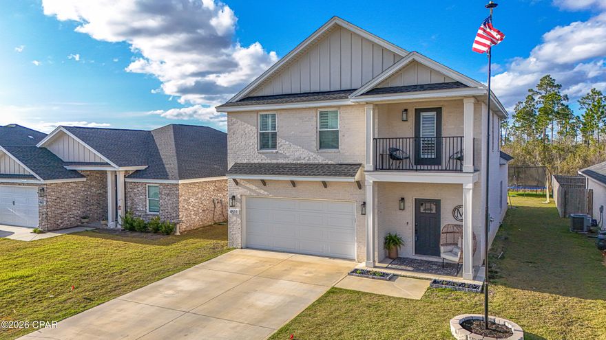 Experience the perfect blend of durability and sophisticated design in this incredibly well-maintained 2023 brick home. Boasting 5 bedrooms, 2.5 bathrooms, and two distinct living areas, this residence offers space and flexibility --all situated in a prime location - just off Hwy 231 between Tyndall Air Force Base and Panama City Beach.

Thoughtful interior design
dual Living Spaces: The main level features a stunning living room with custom-built bookcase that perfectly matches the kitchen cabinetry. Upstairs, a second living area offers a contemporary space perfect for a media room or play area.

Chef's Dream Kitchen: centrally located for effortless flow, the kitchen features custom solid wood cabinets, sleek quartz countertops, and luxury vinyl flooring that runs wall-to-wall. Note: The custom matching dining table may be negotiated with offers.

Primary Suite Sanctuary: Retreat to a spa-like bath featuring an elegant stand-alone tub, walk-in shower, and double vanities. The spacious walk-in closet offers the ultimate convenience with direct access to the laundry room.

Premium Upgrades & smart features
custom touches: outfitted throughout with timeless Charleston-style shutters and modern finishes.

Smart Security: Peace of mind comes standard with a full security system and a remote-controlled thermostat.

Exterior Excellence: Low-maintenance living  with a full sprinkler system, underground utilities, and professionally installed exterior holiday lighting.

The Neighborhood
enjoy the safety and charm of a community designed for walking, featuring lighted streets and sidewalks. This move-in-ready gem offers the peace of mind of newer construction without the wait of a new build.