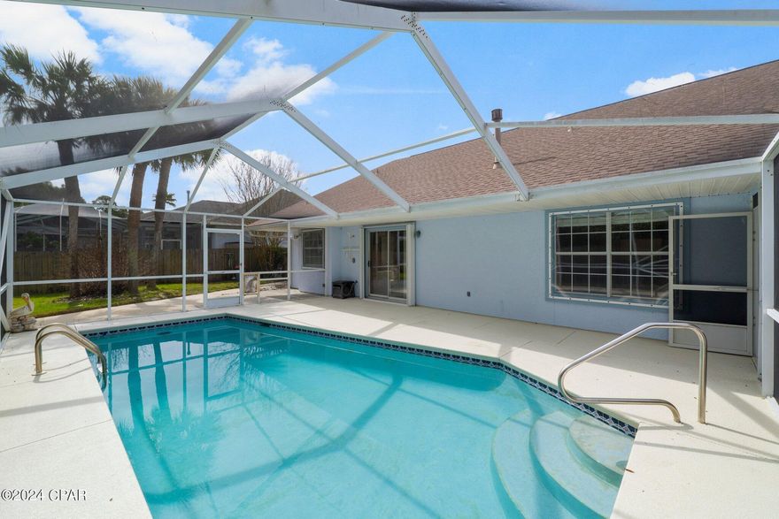 CURRENTLY UNDER CONTRACT, SELLER WILL CONSIDER BACKUP OFFERS
 BEST PRICED HOME on the south side of the parkway in the desired Summer Breeze subdivision. Solid 3 bedroom/2 bathroom home with geothermal HVAC system and solar panels for Energy Efficiency. Screened in pool with privacy fenced back yard. No Short Term Rentals. Walking distance to the beach.