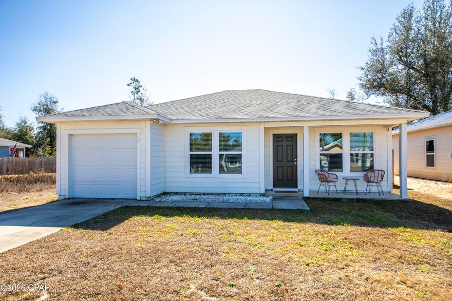 Welcome to this charming three-bedroom, two-bath home located in the desirable Bayhead Park area, just north of town off Hwy 2301. Tucked away from the hustle and bustle, this modern-meets-traditional home offers peaceful countryside living while remaining conveniently close to town. A welcoming covered front porch leads into an open-concept floor plan that seamlessly connects the living, dining, and kitchen areas-perfect for everyday living and entertaining.The kitchen features white shaker cabinetry, a breakfast bar, pantry, white marble-style countertops, and stainless-steel appliances. Just off the kitchen, the laundry room provides an additional storage closet and access to the covered back porch and newly fenced backyard. The elongated single-car garage offers ample space for parking plus extra storage. With the neighborhood being surrounded by Deerpoint Lake, this location is a fisherman's dream with multiple nearby parks and boat landings. Enjoy a short walk to the closest park, Cherokee Street boat landing and picnic area-photos of this county maintained park are included in the listing. Homes like this in this price range are hard to find. Don't miss your opportunity-schedule a showing today!