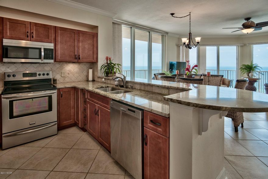 Are you looking for an immaculate, turn-key, beach front condo? Great news, you found it!  Welcome to Tidewater Beach Resort #1217 in Panama City Beach, Florida. This gorgeous three bedroom, three bathroom, plus bunks is ideally situated on the eastern corner of the development and is a true delight! The wide open kitchen/living concept offers unparalleled views through expansive wraparound windows overlooking the fabulous emerald waters of Northwest Florida. This specific condo has been almost entirely renovated and is in PRISTINE condition and is a true value amongst other comparable condos in the marketplace.  The property is being sold fully furnished and decorated and has never been rented so it is truly ''like new'' and boasts tremendous rental potential. This condo features an extensive list of upgrades such as fresh paint throughout, new furniture, new high quality mattresses, all new lighting fixtures included added lighting in some areas.  The kitchen has been completely renovated including ALL NEW 3cm granite, sink, faucets, wooden self closing cabinets/drawers/hardware, tile backsplash, accent lighting, garbage disposal, under sink water filter, and all new stainless appliances! The condo also features new 18x18 diagonal tile in the living room, kitchen, hallways, bunk room and adjoining bathroom.  New exhaust fans have been put in all bathrooms, new sink and faucets in the master bathroom with matching granite from the kitchen, new blinds in the living room and dining area, new patio furniture and storage bin on the balcony and brand new front load washer and dryer.  Seriously, this is an incredible opportunity to purchase a one of a kind condo for an attractive price.  The views will never disappoint and you can enjoy views of the pier at Pier Park to catch fireworks like you've never seen before.  

Tidewater features amenities such as a Gulf front gym, 4 hot tubs, 2 outdoor pools, 1 indoor heated pool, game room, saunas, steam rooms, a restaurant, poolside Tiki bar, a convenience store, movie theater, covered parking, a conference room & an owners lounge. Only 1/2 mile to PIER PARK!!!