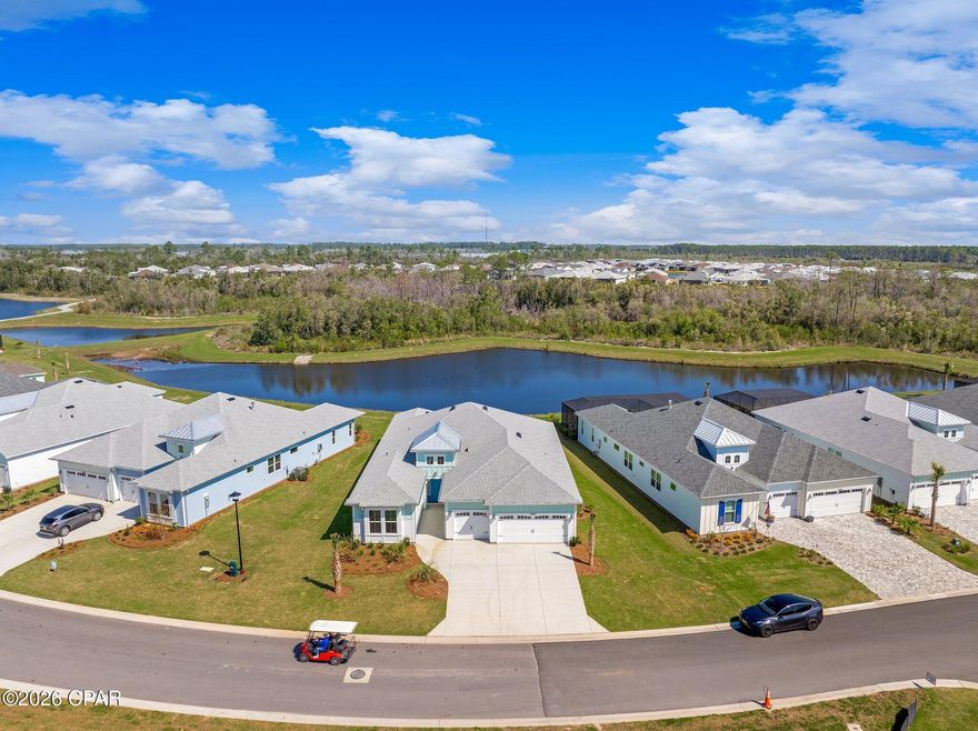 PHASE 3 - TRINIDAD BAY -  POND VIEW - Brand new and never lived in, this highly sought-after Island Collection Trinidad Bay floorplan is move-in ready and located on one of the most desirable lots in the community. The home features 3 bedrooms plus a den/optional 4th bedroom, 3.5 bathrooms, and sits on an oversized pond-front homesite with space for a future pool.

Ideally located close to the community amenities and the Intracoastal Waterway, this property offers both convenience and scenic water views. The home includes numerous high-end upgrades such as wood-look tile throughout, gas cooktop, and a spacious, open layout designed for luxurious and comfortable living and entertaining. 

Located in Latitude Margaritaville Watersound, an active adult community just minutes from the Panama City Beach airport, offering resort-style amenities including a private restaurant with three bars, resort pool, live entertainment 7 days a week, pickleball, bocce ball, cornhole, putting green, Fins Up Fitness Center, indoor lap pool, and whirlpool spa, along with a full lifestyle program and daily activities.  Enjoy the newest amenities such as the full size theatre, Barkaritaville dog spa, woodworking shop, pottery room, business center, and community rooms for clubs and gatherings. The community also features expanding retail with a golf cart store and bank currently open, with Publix just breaking ground and many services and restaurants planned.